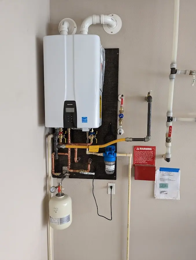 Professional plumber installing copper piping in a Glen Ridge home